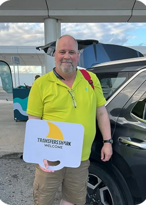 Happy customer at Cancun Airport yellow happy guy